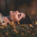 Woman laying on flowers