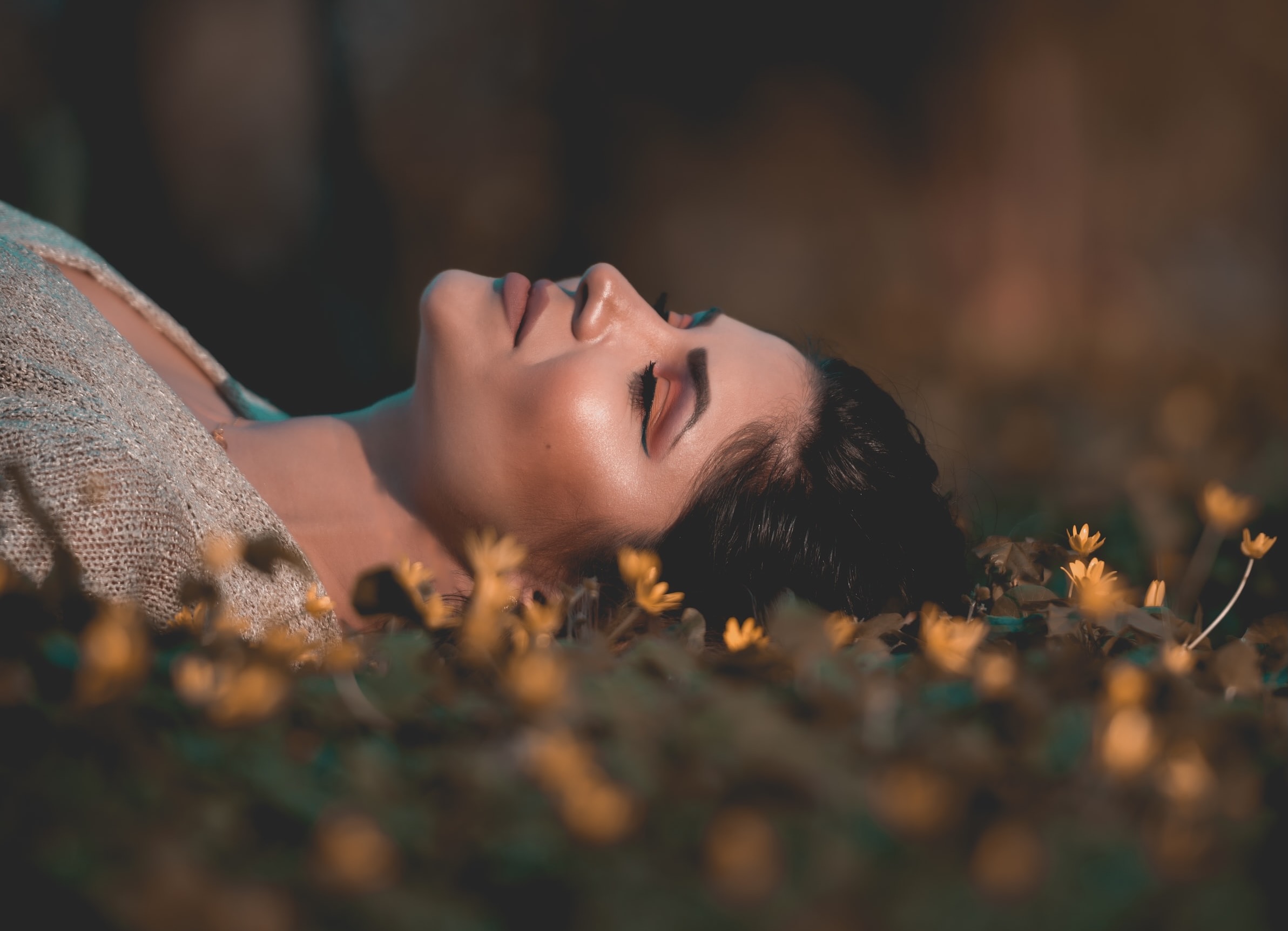 Woman laying on flowers