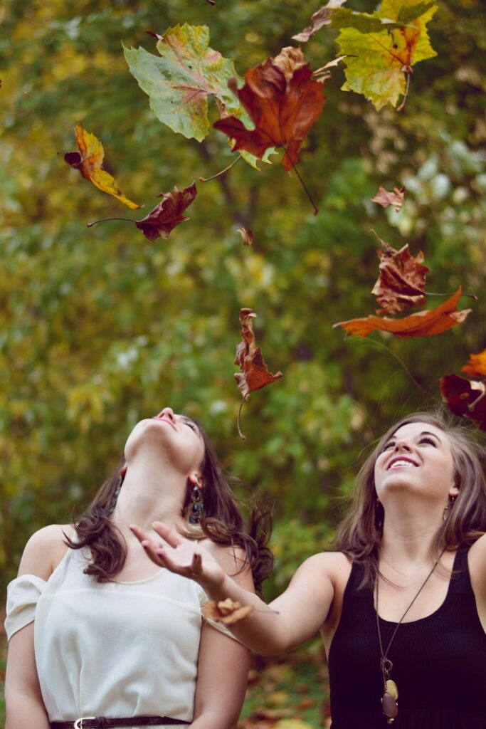 Women playing in autumn