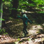 Child playing in a wood